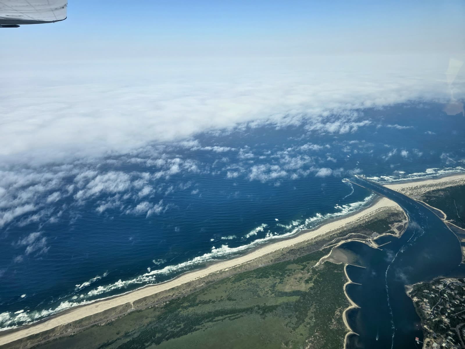 Coastline with the marine layer tucked underneath.
